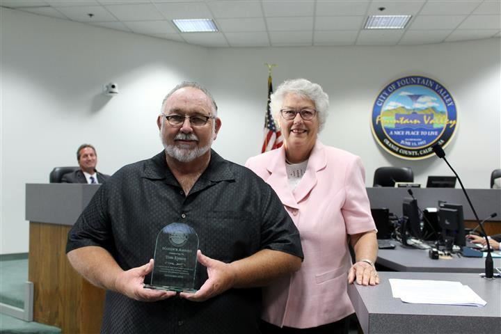 Tom Eynon recieves the Mayor's Award from Mayor Cheryl Brothers